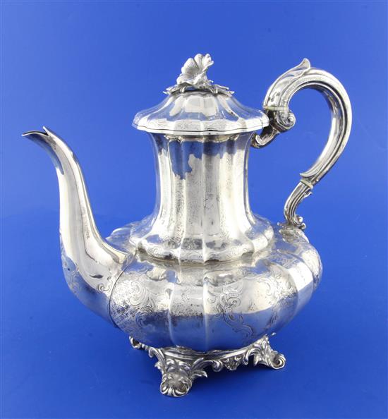 A Victorian engraved silver melon shaped coffee pot by Charles Thomas Fox & George Fox, gross 27.5 oz.